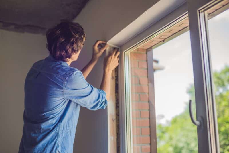 window installer completing a window installation on a residential home